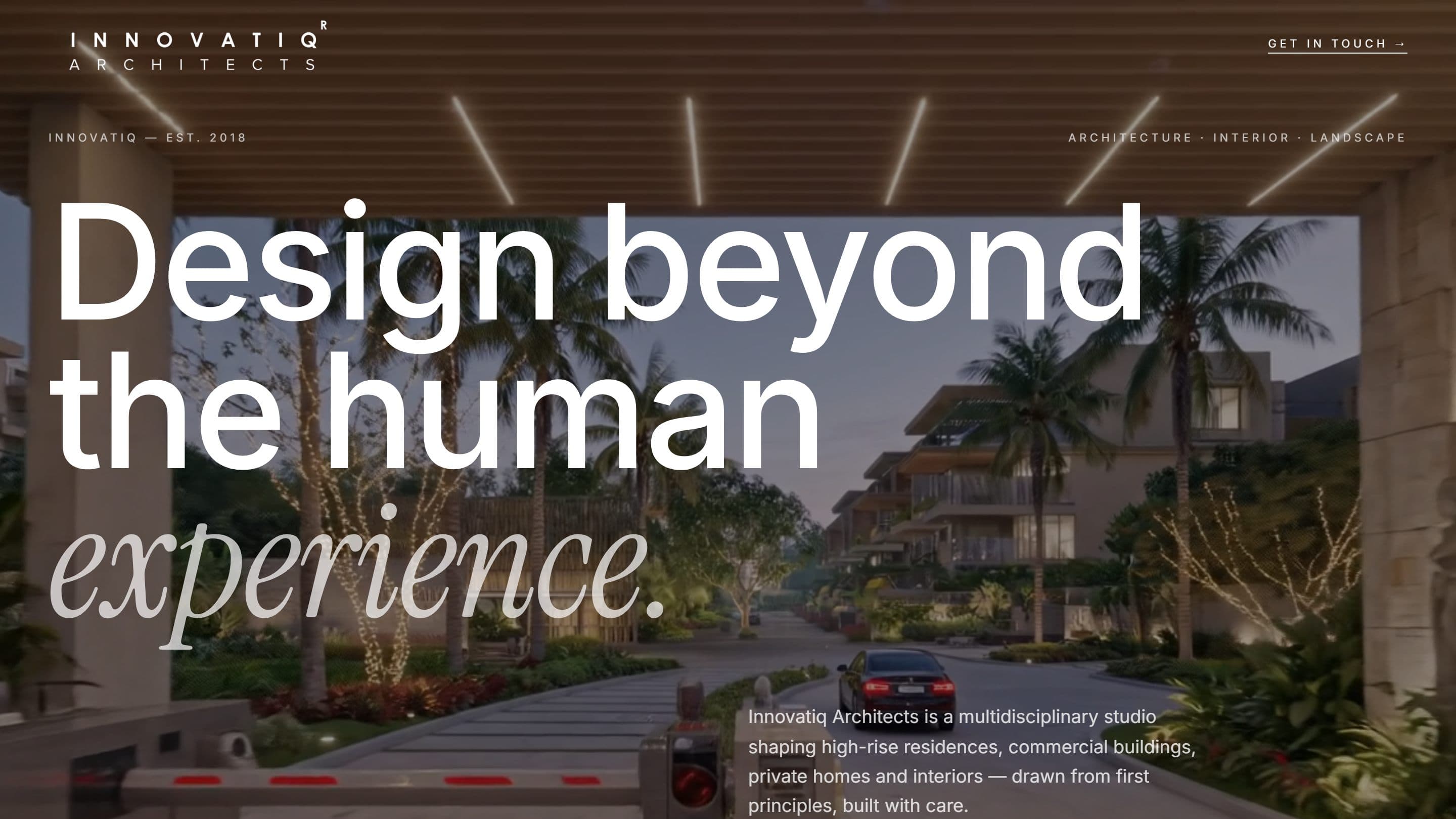 The Innovatiq Architects homepage: the headline "Design beyond the human experience" set over a dusk photograph of a landscaped high-rise residential approach